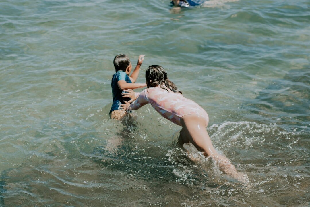 family snorkeling in ocean